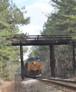 CSX 3159 in DPU service bringing up rear of hopper train.